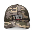 Camo Trucker Hat — Embroidered “Slightly Human” Patch