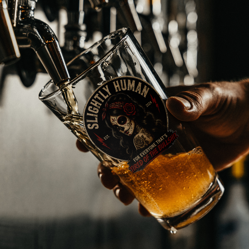 Slightly_Human_Sugar_Skull_Pint_Glass_Pint_Glass_Dark_Lifestyle_Mockup.png_15816217